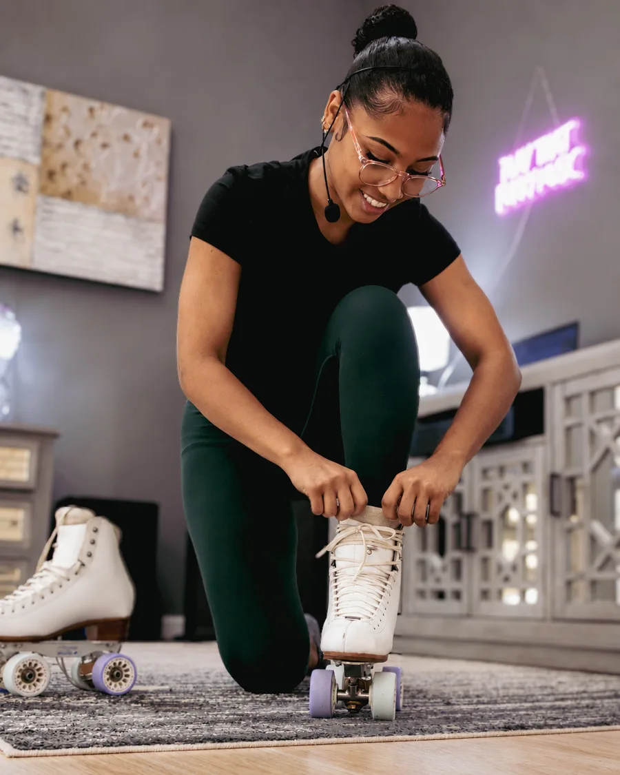 Michaela lacing up her skates